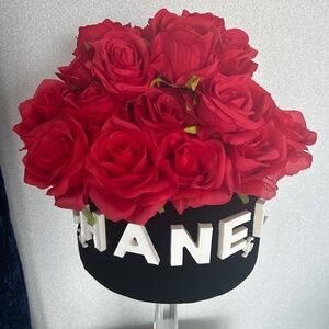 Red silk roses in black velvet box with white raised lettering